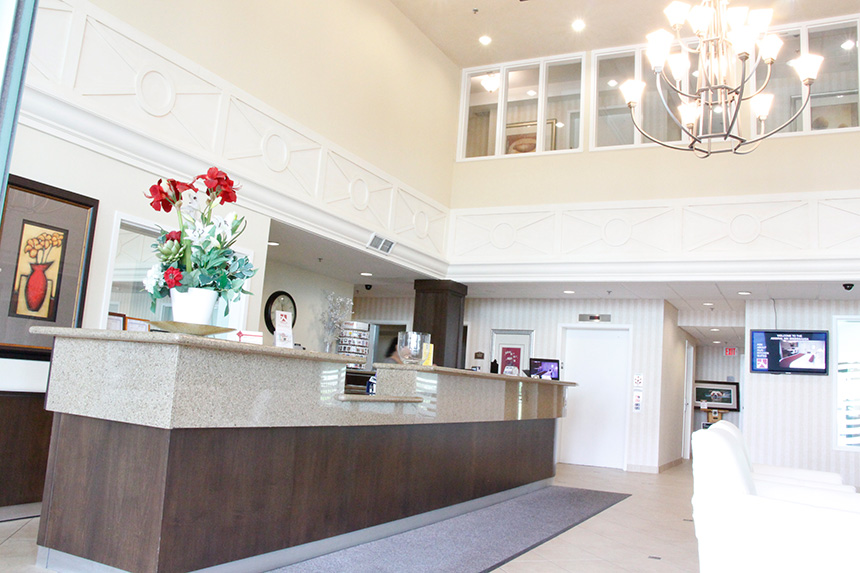 Front desk of the Admiral Inn Mississauga Hotel