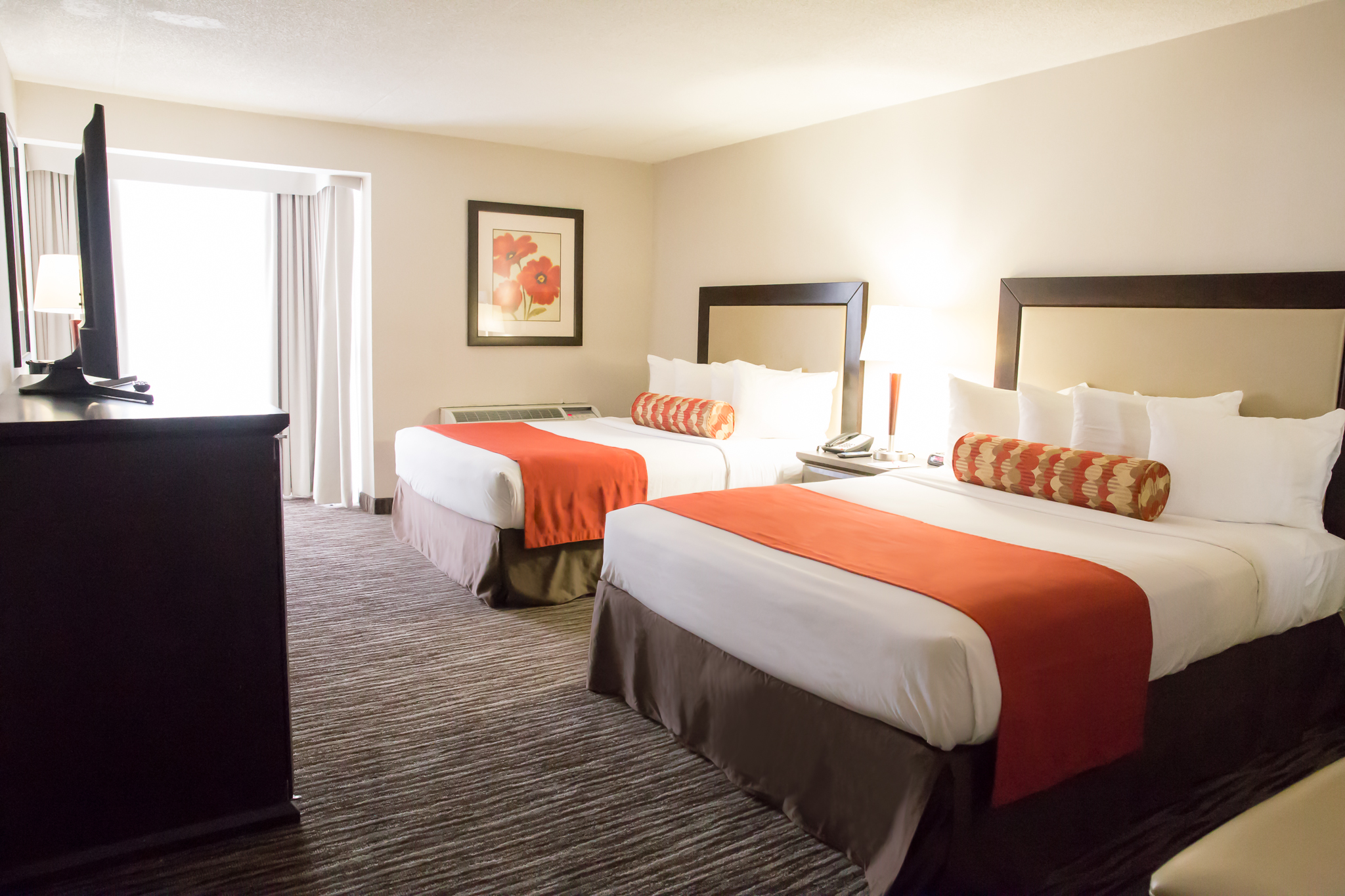 Bedroom with two queen beds and a flat screen television